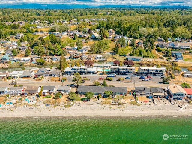 bird's eye view featuring a beach view and a water view