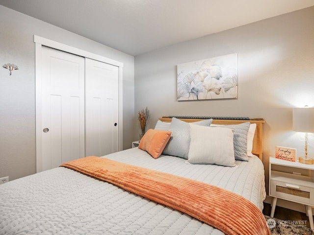 bedroom featuring hardwood / wood-style flooring and a closet