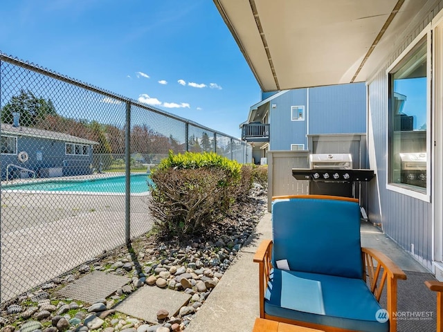 view of pool with grilling area