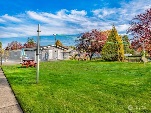 view of yard featuring volleyball court