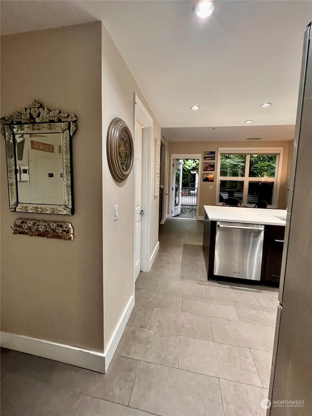 hall with light tile patterned flooring