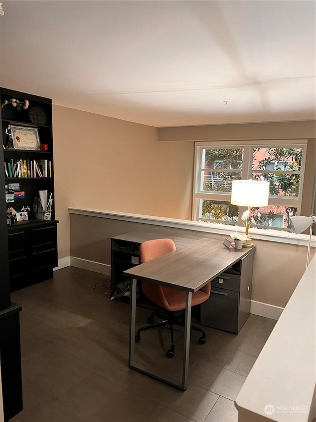 home office with tile patterned flooring