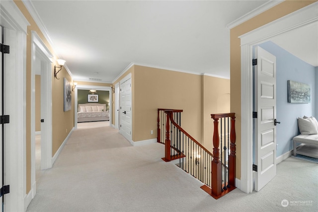 corridor featuring light carpet and crown molding