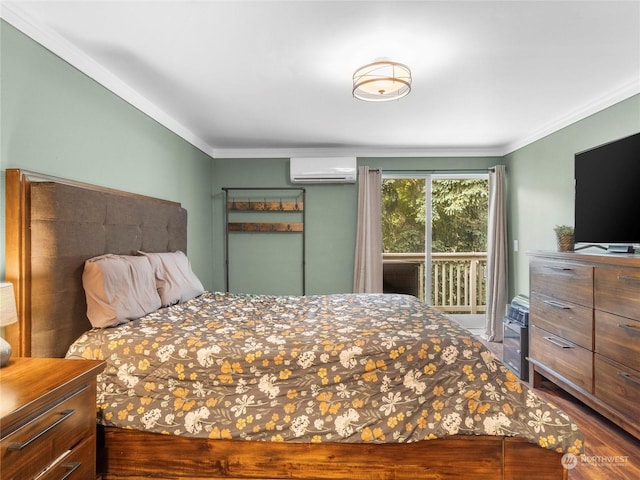 bedroom with an AC wall unit, hardwood / wood-style flooring, ornamental molding, and access to outside