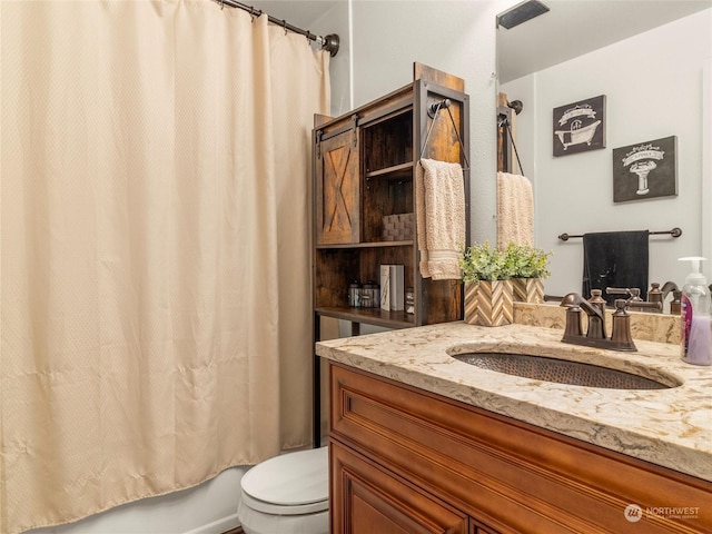 full bathroom featuring toilet, shower / tub combo, and vanity