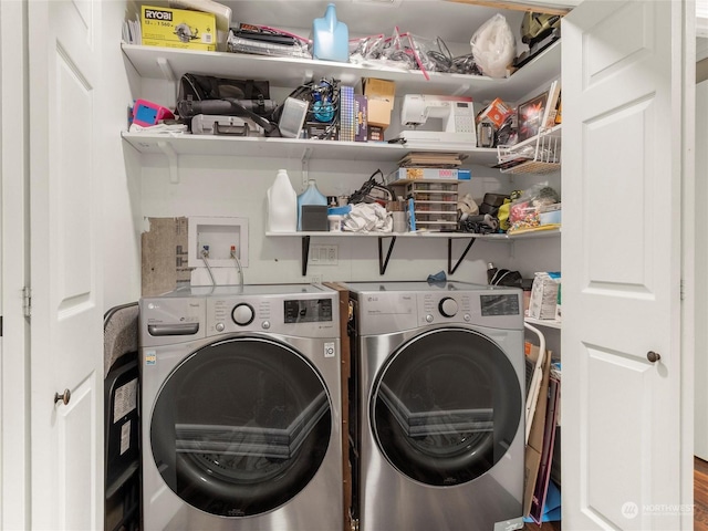 clothes washing area with washer and dryer