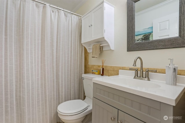 bathroom with vanity, tile walls, a shower with shower curtain, and toilet