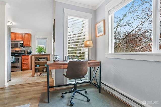 office with crown molding, plenty of natural light, and light wood-type flooring