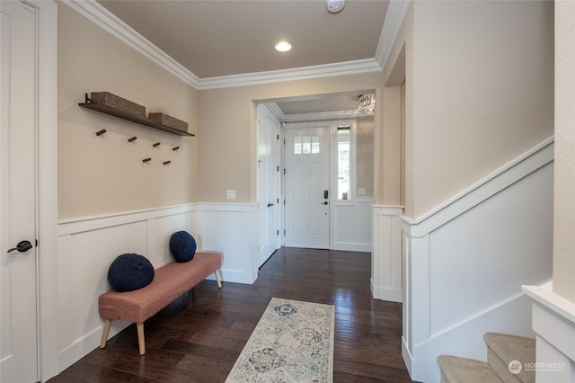 interior space with dark wood finished floors, crown molding, recessed lighting, and wainscoting