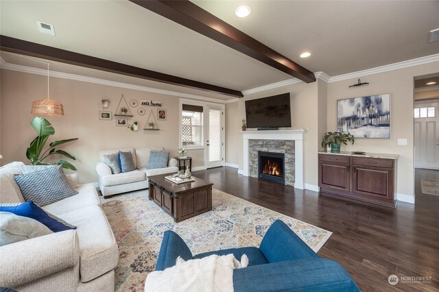 living area with a wealth of natural light, beamed ceiling, dark wood-style floors, and a fireplace