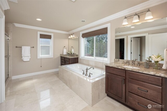 full bath featuring a garden tub, ornamental molding, a shower stall, baseboards, and vanity