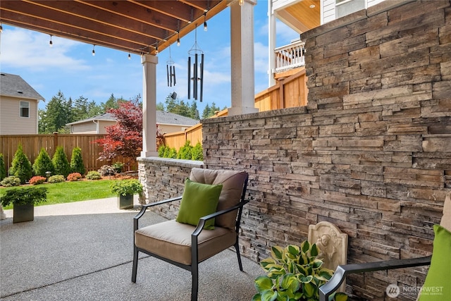 view of patio / terrace featuring fence