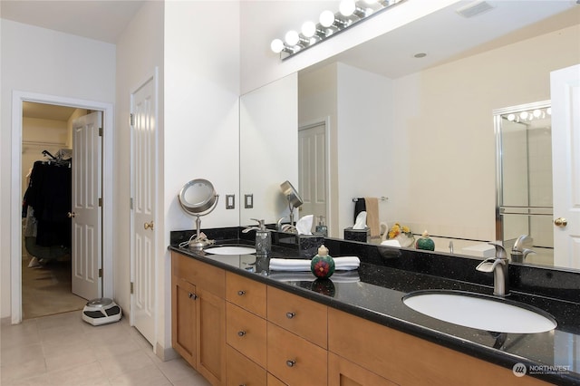 bathroom featuring vanity and tile patterned flooring