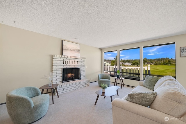 living room with light carpet, a textured ceiling, and a brick fireplace