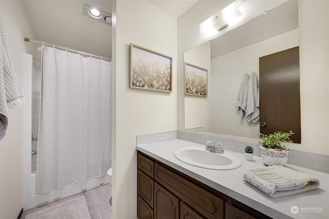 full bathroom with shower / bath combo, toilet, and vanity