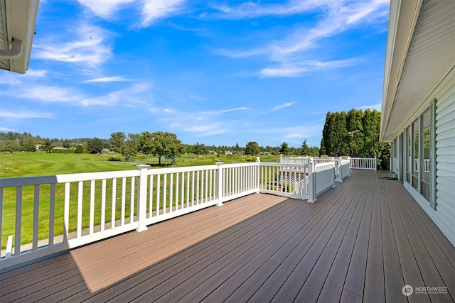 wooden terrace with a yard