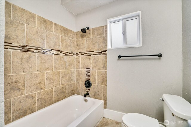 full bath with toilet and bathtub / shower combination