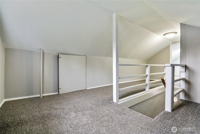 bonus room featuring carpet flooring and lofted ceiling