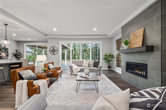 living room featuring a fireplace and hardwood / wood-style flooring