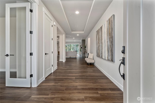 corridor featuring dark wood-type flooring