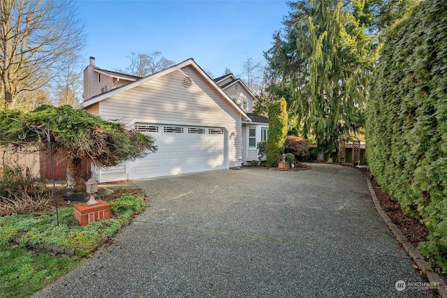 view of side of property featuring a garage