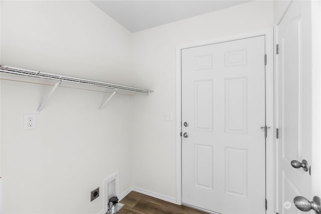 laundry area with dark hardwood / wood-style floors and hookup for an electric dryer