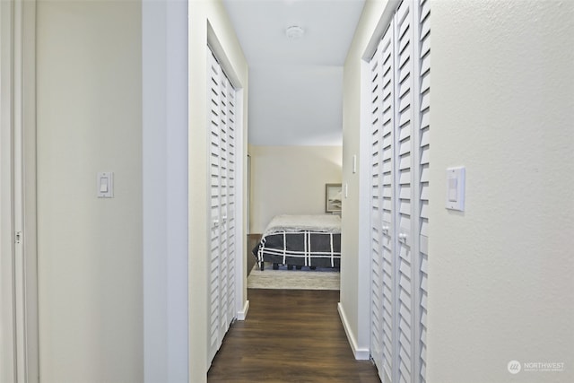 hallway featuring dark hardwood / wood-style floors