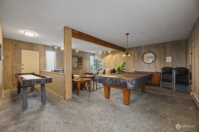 game room with wood walls, billiards, beamed ceiling, and a textured ceiling