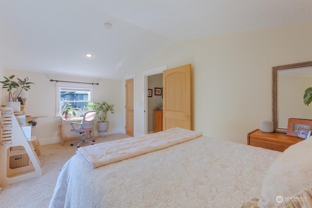 bedroom featuring vaulted ceiling and light colored carpet