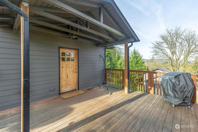 wooden deck with grilling area