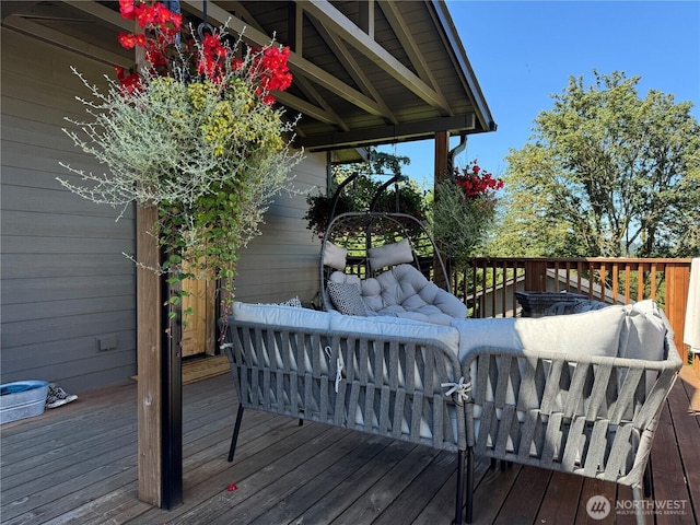 wooden terrace featuring outdoor lounge area