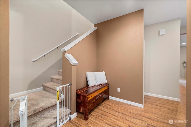 stairs with wood-type flooring