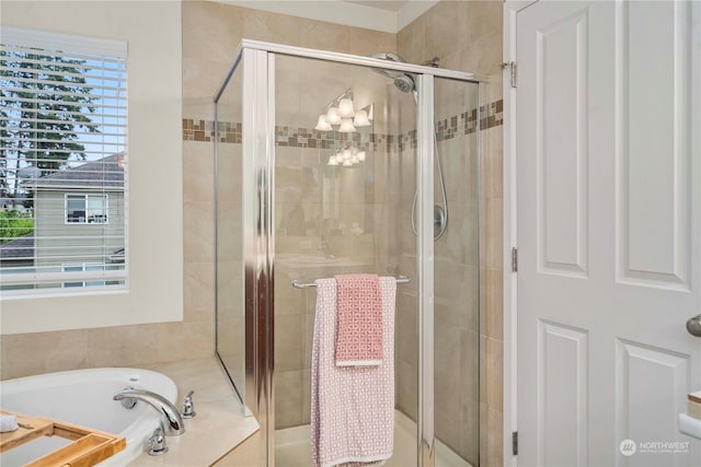 bathroom with shower with separate bathtub