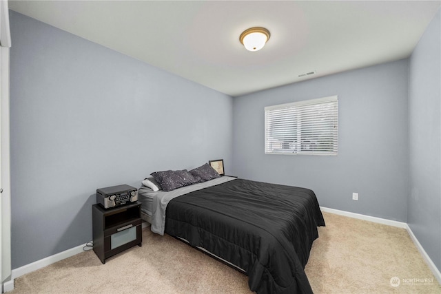 bedroom with light carpet