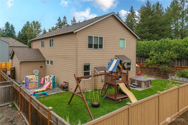 view of jungle gym featuring a lawn