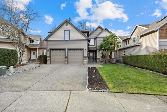 view of front of property featuring a garage and a front yard