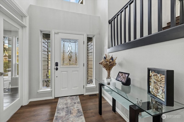 entryway with dark hardwood / wood-style floors