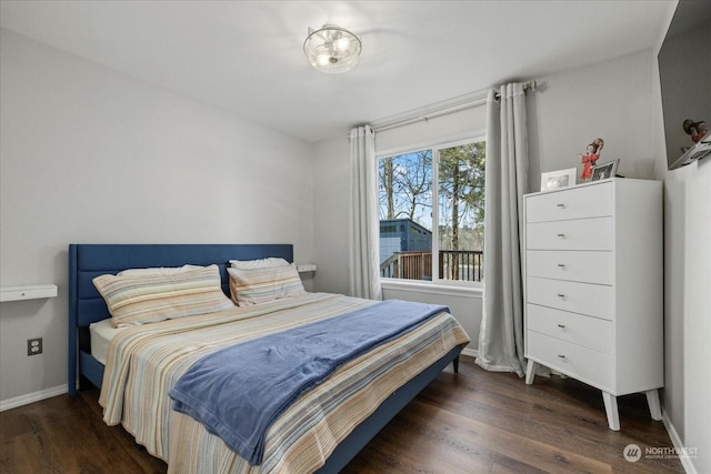 bedroom featuring dark hardwood / wood-style flooring