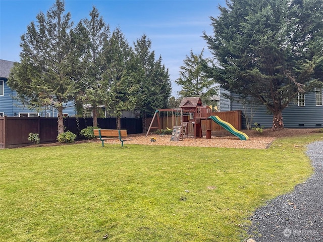 view of jungle gym featuring a lawn