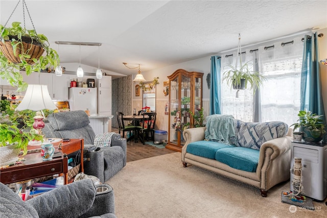 living room with wood-type flooring and lofted ceiling