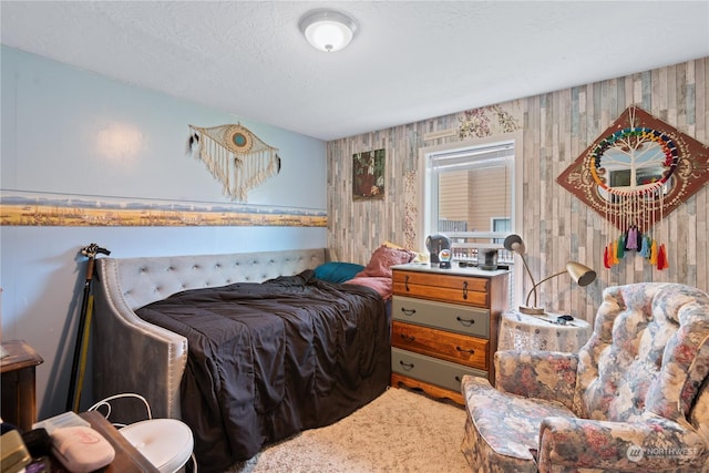 carpeted bedroom with a textured ceiling