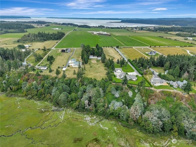 birds eye view of property with a rural view and a water view