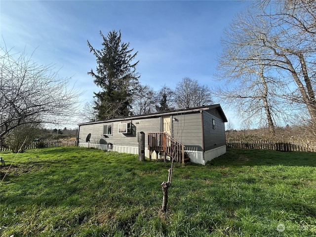 rear view of house with a lawn