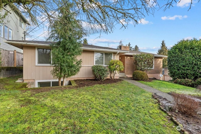 ranch-style house with a front lawn