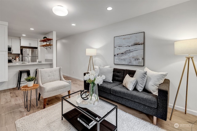 living room with light hardwood / wood-style floors