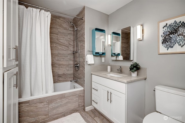 full bathroom featuring vanity, toilet, and shower / bath combo with shower curtain