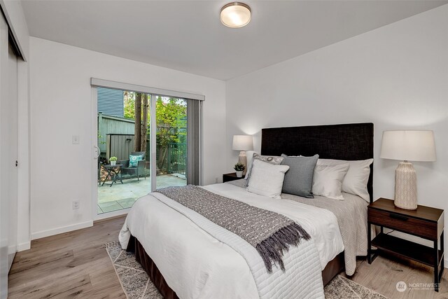 bedroom with access to exterior, a closet, and light wood-type flooring