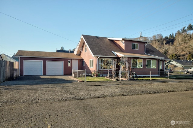 view of front of house featuring a front lawn and a garage