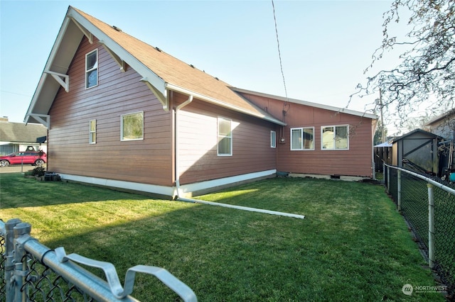 rear view of house with a yard