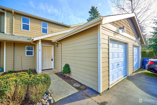 view of exterior entry featuring a garage